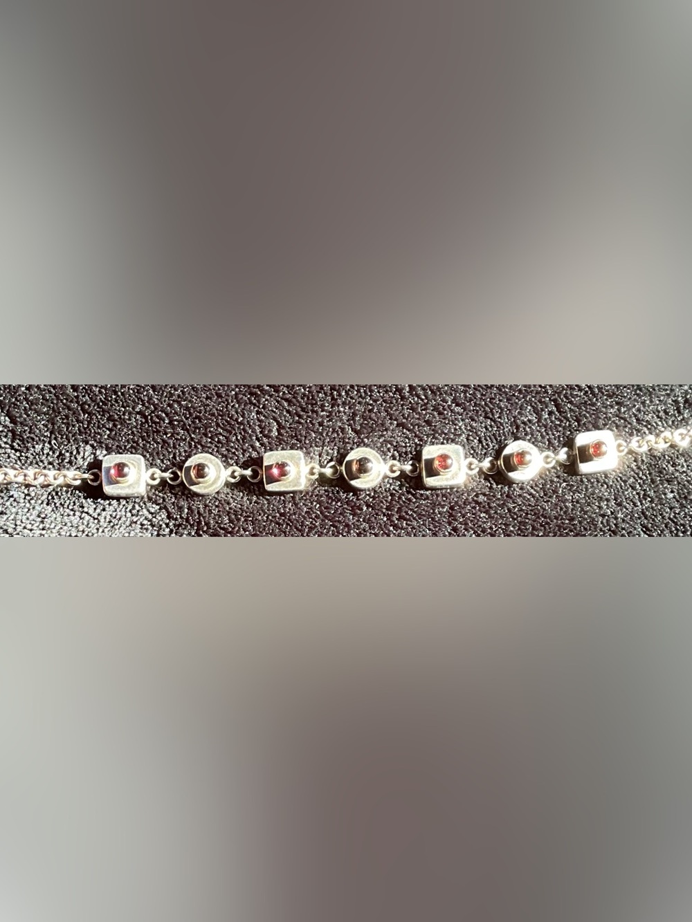 Sterling Silver Bracelet with Deep Red and Purple Gem Stone Accents